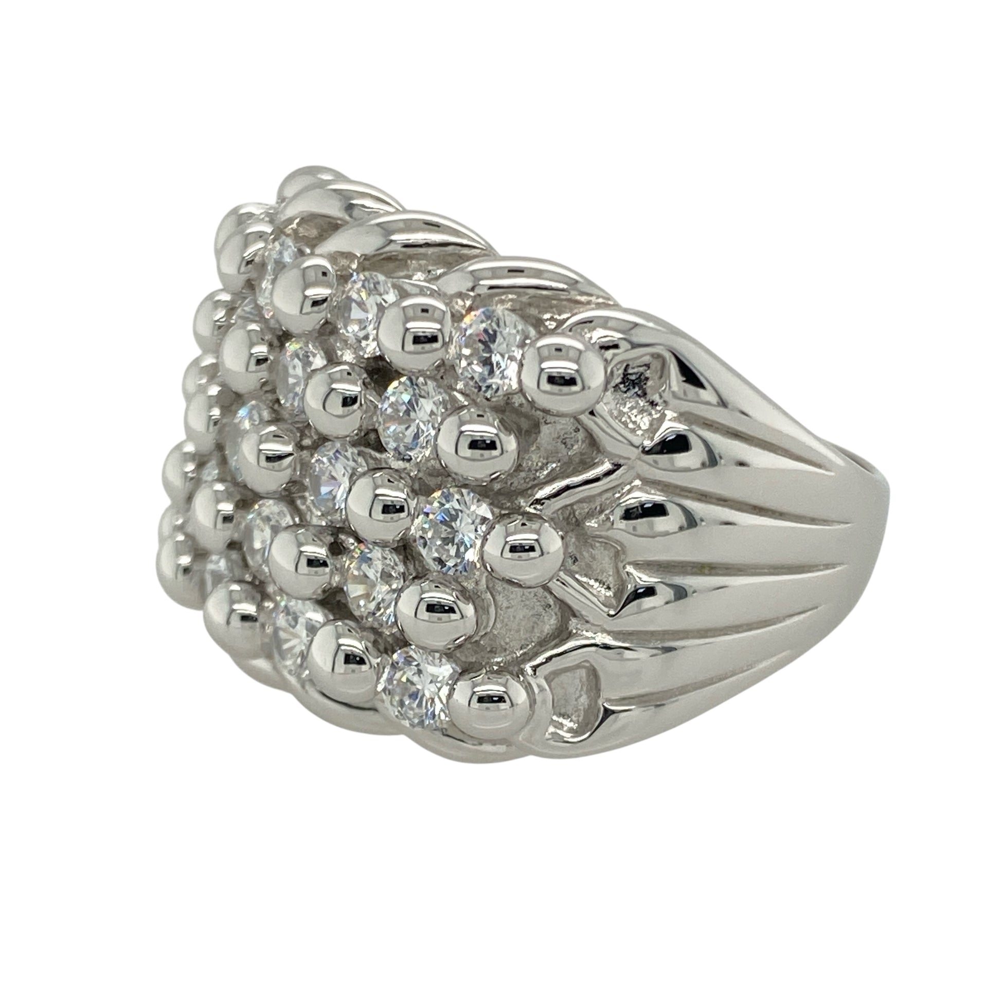Bring dazzling detail and bold sophistication to your collection with this pre-owned 925 silver and cubic zirconia set five row keeper ring, offering striking sparkle and a confident presence—perfect for those who love standout statement pieces.

Design: The ring features a wide front measuring 19mm high, designed with five rows set with shimmering cubic zirconia stones. The intricate, layered look creates a bold and eye-catching texture, adding depth and brilliance from every angle.
