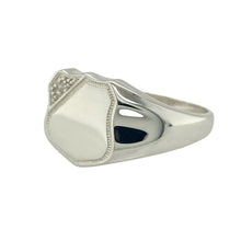 Load image into Gallery viewer, Bring sleek style and subtle sparkle to your collection with this new 925 silver and cubic zirconia set shield signet ring, offering a modern design and refined detail—perfect for those who appreciate understated statement pieces.

Design: The ring features a polished shield-shaped front measuring 14mm high, accented with a small cubic zirconia stone set in the corner for a touch of subtle brilliance. The clean, angular design creates a contemporary and sophisticated look.

