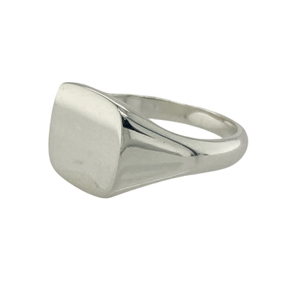 Bring modern simplicity and timeless style to your collection with this new 925 silver plain square signet ring, offering a sleek design and confident presence—perfect for those who appreciate clean, understated elegance.

Design: The ring features a polished square front measuring 12mm high, creating a bold yet minimalist look. The smooth surface offers a contemporary feel and can be worn alone or engraved for a personal touch.
