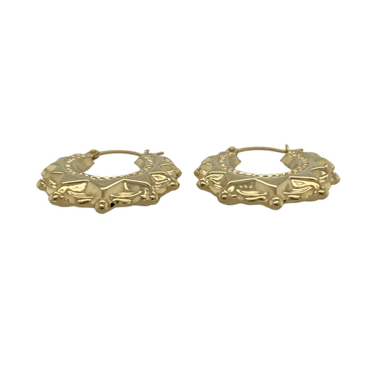Bring warm elegance and timeless shine to your collection with these new 9ct yellow gold fancy round creole earrings, offering a classic design and refined detail—perfect for adding a touch of sophistication to any look.

Design: The earrings feature a stylish round creole style with a fancy, detailed finish, measuring approximately 20mm in diameter. Their graceful curves and intricate pattern create an effortlessly chic and versatile silhouette.
