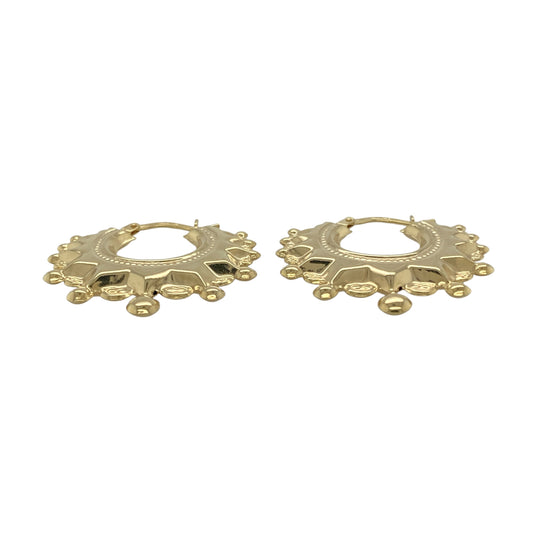 Bring warm elegance and striking shine to your collection with these new 9ct yellow gold fancy round creole earrings, offering a classic design and refined presence—perfect for making a sophisticated statement.

Design: The earrings feature a larger round creole style with a fancy, detailed finish, measuring approximately 28mm in diameter. Their graceful curves and intricate design create an eye-catching and versatile silhouette.
