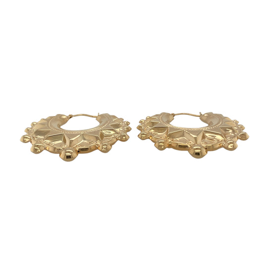 Bring warm elegance and striking sophistication to your collection with these new 9ct yellow gold fancy round creole earrings, offering a bold design and radiant presence—perfect for making a confident statement.

Design: The earrings feature a large round creole style with a fancy, detailed finish, measuring approximately 38mm in diameter. Their flowing curves and intricate pattern create an eye-catching silhouette that beautifully frames the face.
