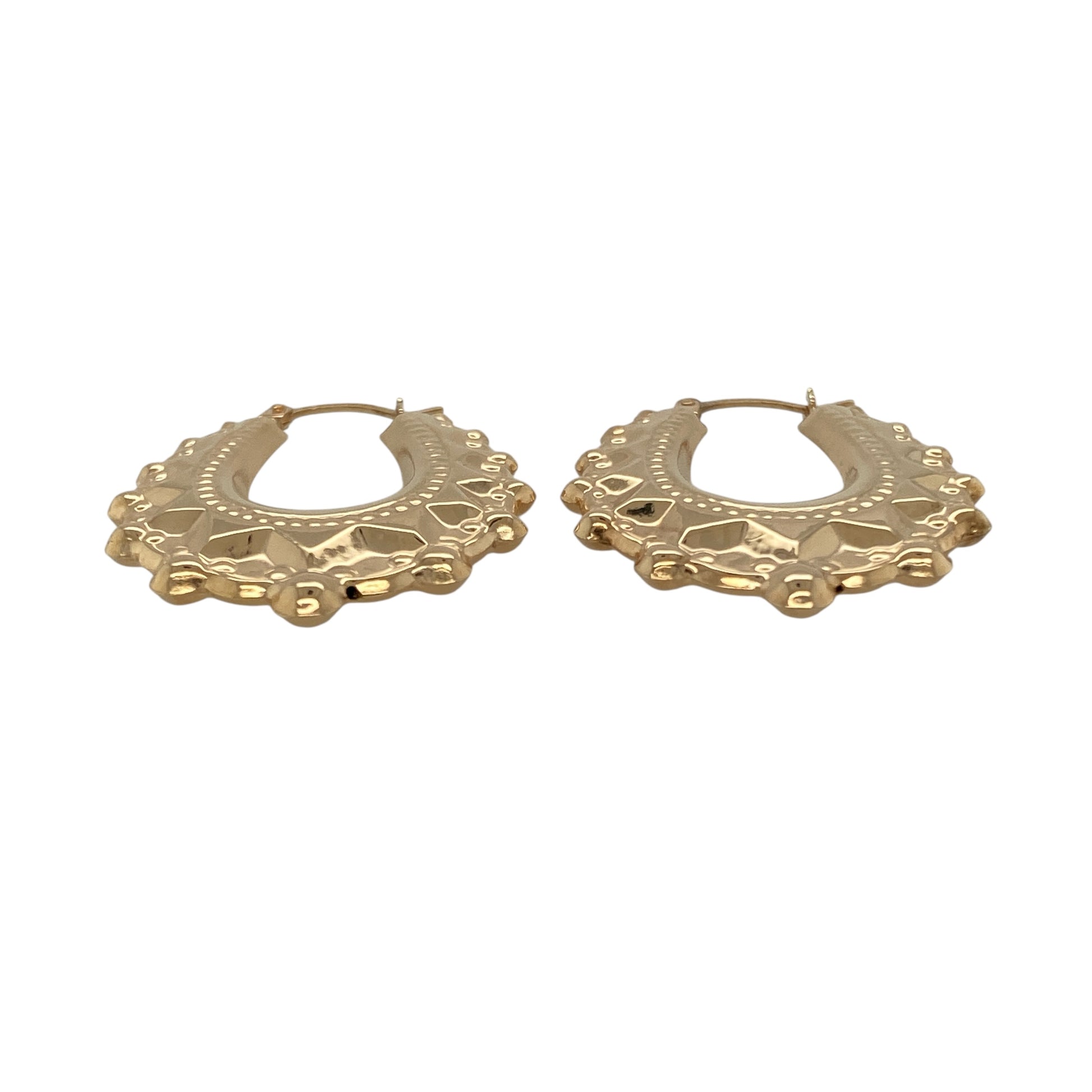 Bring warm elegance and graceful style to your collection with these new 9ct yellow gold fancy oval creole earrings, offering a refined design and timeless charm—perfect for elevating any look.

Design: The earrings feature an elegant oval creole style with a fancy, detailed finish, measuring approximately 24mm across. Their elongated shape and intricate pattern create a flattering, eye-catching silhouette that complements any outfit.
