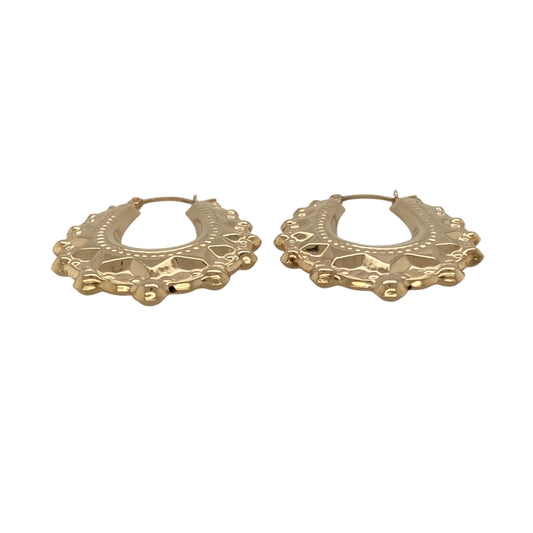 Bring warm elegance and graceful style to your collection with these new 9ct yellow gold fancy oval creole earrings, offering a refined design and timeless charm—perfect for elevating any look.

Design: The earrings feature an elegant oval creole style with a fancy, detailed finish, measuring approximately 24mm across. Their elongated shape and intricate pattern create a flattering, eye-catching silhouette that complements any outfit.
