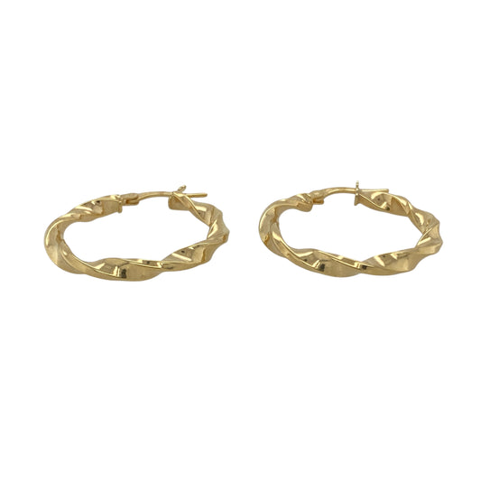 Bring warm elegance and modern texture to your collection with these new 9ct yellow gold twisted hoop creole earrings, offering a stylish design and timeless shine—perfect for adding a refined touch to any look.

Design: The earrings feature a sleek twisted hoop creole style, measuring approximately 25mm in diameter. The twisted detailing creates a dynamic, eye-catching effect that adds depth and movement.
