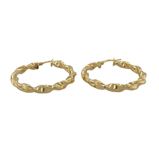 Bring warm elegance and contemporary texture to your collection with these new 9ct yellow gold twisted hoop creole earrings, offering a bold design and refined shine—perfect for making a sophisticated statement.

Design: The earrings feature a stylish twisted hoop creole style, measuring approximately 33mm in diameter. The twisted detailing adds dynamic movement and a modern edge to this classic silhouette.
