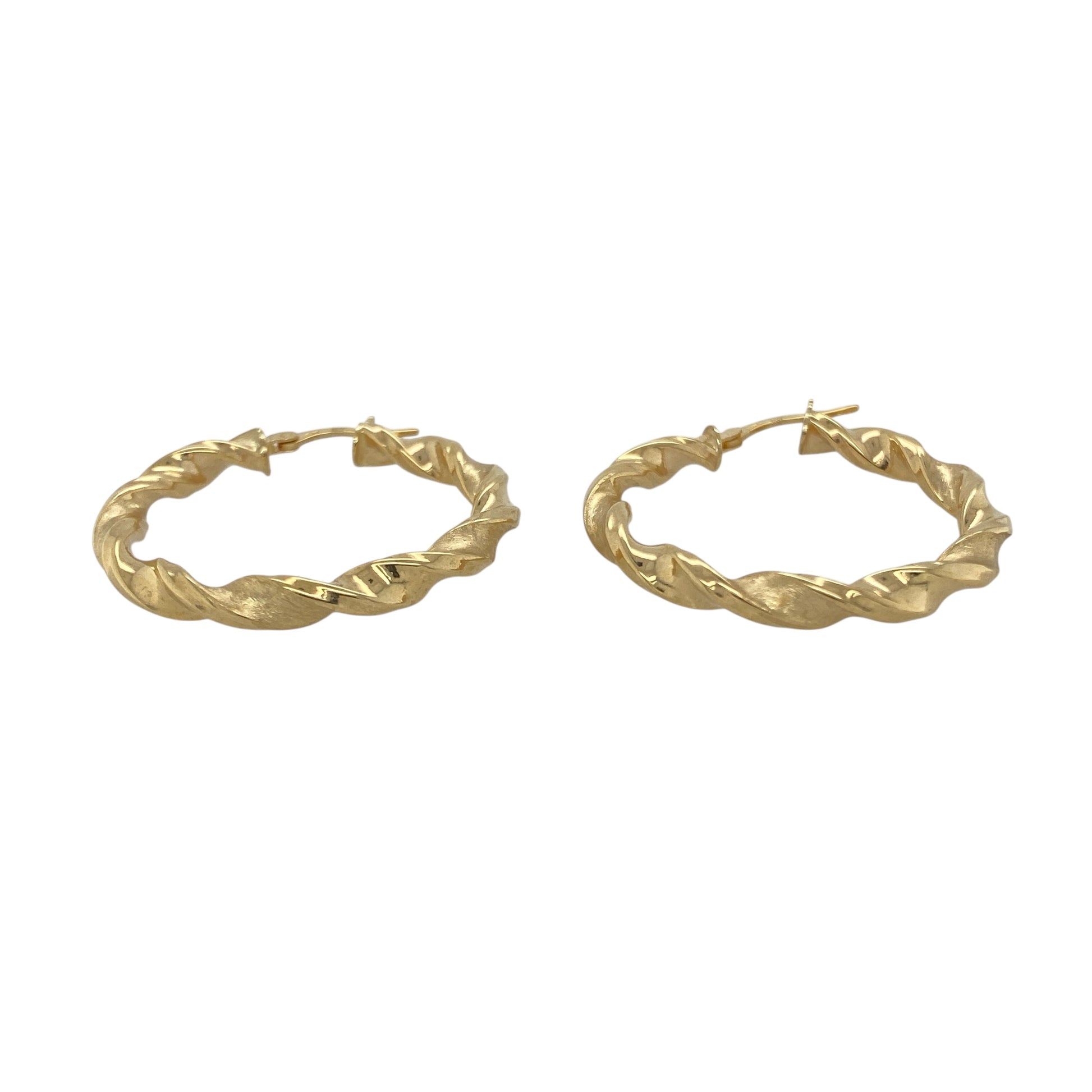 Bring modern elegance and refined texture to your collection with these new 9ct yellow gold brushed effect twisted hoop creole earrings, offering a bold design and sophisticated shine—perfect for making a stylish statement.

Design: The earrings feature a sleek twisted hoop creole style with a brushed effect finish, measuring approximately 34mm in diameter. The combination of the twist and soft brushed texture creates a dynamic, contemporary look that stands out beautifully.
