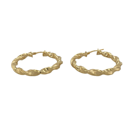 Bring modern elegance and refined texture to your collection with these new 9ct yellow gold brushed effect twisted hoop creole earrings, offering a bold design and sophisticated shine—perfect for making a stylish statement.

Design: The earrings feature a sleek twisted hoop creole style with a brushed effect finish, measuring approximately 34mm in diameter. The combination of the twist and soft brushed texture creates a dynamic, contemporary look that stands out beautifully.
