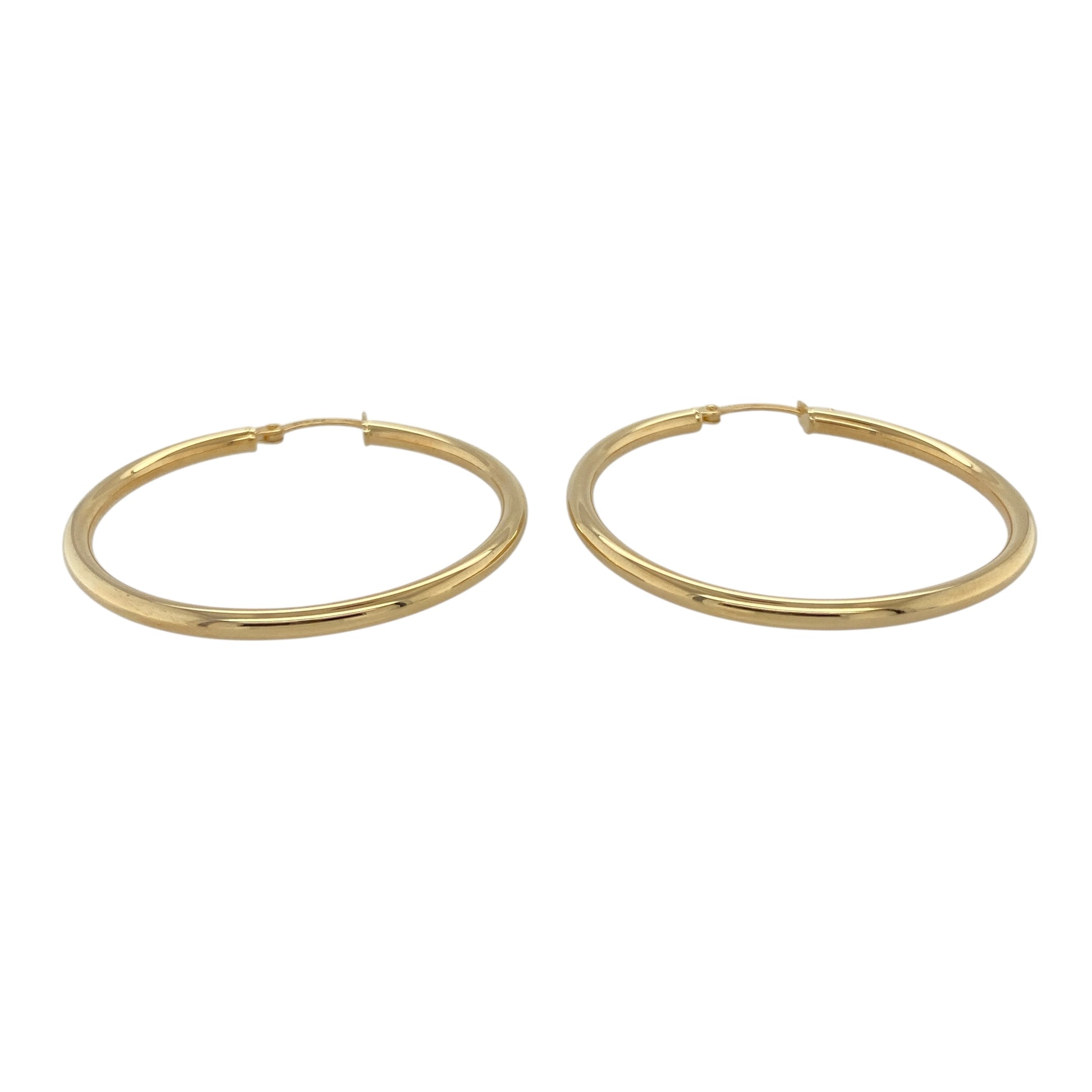 Bring timeless elegance and classic shine to your collection with these new 9ct yellow gold plain hoop creole earrings, offering a sleek design and versatile style—perfect for adding a polished touch to any look.

Design: The earrings feature a simple and smooth hoop creole style, measuring approximately 40mm in diameter. The clean, minimalist design creates a timeless silhouette that pairs effortlessly with any outfit.
