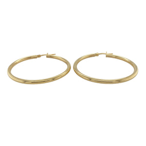 Bring timeless elegance and effortless shine to your collection with these new 9ct yellow gold plain hoop creole earrings, offering a sleek design and versatile style—perfect for adding a classic touch to any look.

Design: The earrings feature a smooth and minimalist hoop creole style, measuring approximately 39mm in diameter. The clean lines and simple silhouette make them a timeless and easy-to-wear choice for any occasion.
