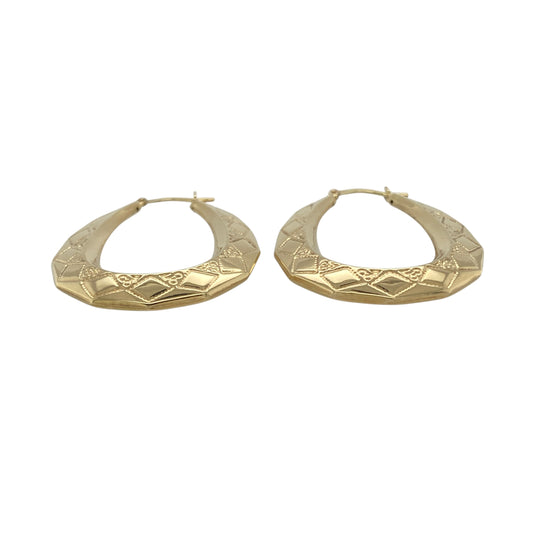 Bring refined elegance and eye-catching detail to your collection with these new 9ct yellow gold patterned oval creole earrings, offering a sophisticated design and timeless charm—perfect for elevating any look.

Design: The earrings feature an elegant oval creole style with intricate patterned detailing, measuring approximately 30mm across. The elongated shape and textured design create a flattering, unique silhouette that stands out beautifully.
