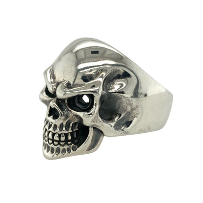 Bring bold edge and fearless style to your collection with this new 925 silver skull ring, offering a striking design and powerful presence—perfect for those who love standout statement pieces.

Design: The ring features a dramatic skull front measuring 25mm high, designed with an open section that adds a raw, edgy character to the piece. The detailed sculpting and hollow element create depth and a rebellious, eye-catching look.
