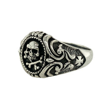 Load image into Gallery viewer, Bring bold attitude and edgy symbolism to your collection with this new 925 silver skull and crossbones signet ring, offering a striking design and fearless presence—perfect for making a powerful statement.

Design: The ring features a dramatic skull and crossbones motif on the front, measuring 18mm high, with patterned shoulders that add extra detail and character. The combination of these elements creates a strong, rebellious look that stands out boldly.

