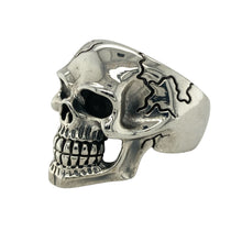 Load image into Gallery viewer, Bring bold edge and striking detail to your collection with this new 925 silver skull ring, offering a powerful design and fearless presence—perfect for making a dramatic statement.

Design: The ring features a large, detailed skull front measuring 26mm high, accented with decorative cracks that add a rugged, realistic touch. The sculpted design creates a strong, rebellious look that stands out with intense character.

