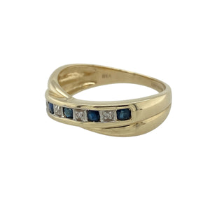 Bring graceful elegance and timeless colour to your collection with this pre-owned 9ct yellow gold diamond and sapphire set crossover band ring, offering a refined design and sophisticated sparkle—perfect for adding a touch of classic charm to any look.

Design: The ring features an elegant crossover band design adorned with alternating diamonds and sapphires, each sapphire measuring approximately 2mm in diameter. The deep blue sapphires beautifully contrast with the shimmering diamonds