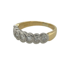 Load image into Gallery viewer, Bring luxurious sparkle and timeless elegance to your collection with this pre-owned 18ct yellow gold and diamond seven stone band ring, offering a refined design and striking presence—perfect for making a sophisticated statement.

Design: The ring features a beautifully crafted woven white gold setting that holds seven shimmering diamonds, with approximately 0.42ct of total diamond content. The intricate design and bright white gold contrast create an eye-catching and elegant focal point.
