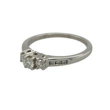 Load image into Gallery viewer, Bring timeless sophistication and radiant sparkle to your collection with this pre-owned platinum and diamond set trilogy ring, offering a refined design and elegant presence—perfect for marking life’s most meaningful moments.

Design: The ring features a classic trilogy design adorned with approximately 0.33ct total of brilliant diamonds, with additional diamonds set in the shoulders for extra shimmer. 

