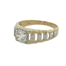 Load image into Gallery viewer, Bring bold sparkle and unique style to your collection with this pre-owned 9ct yellow and white gold cubic zirconia set watch style ring, offering a distinctive design and eye-catching presence—perfect for making a statement.

Design: The ring features a striking watch-inspired design highlighted by a 7mm diameter cubic zirconia stone at the center, creating a bold and brilliant focal point. The combination of yellow and white gold adds contrast and a contemporary edge to the piece.

