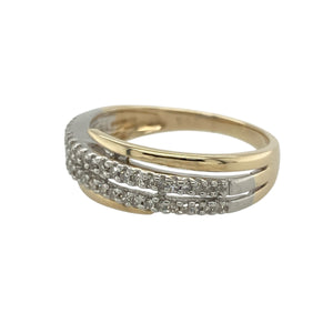 Bring modern elegance and radiant sparkle to your collection with this pre-owned 9ct yellow and white gold and diamond set crossover band ring, offering a striking design and sophisticated presence—perfect for adding a bold yet refined statement to any look.

Design: The ring features an eye-catching crossover design at the front, measuring 8mm wide, adorned with two rows of shimmering diamonds. The flowing lines create a dynamic and contemporary silhouette