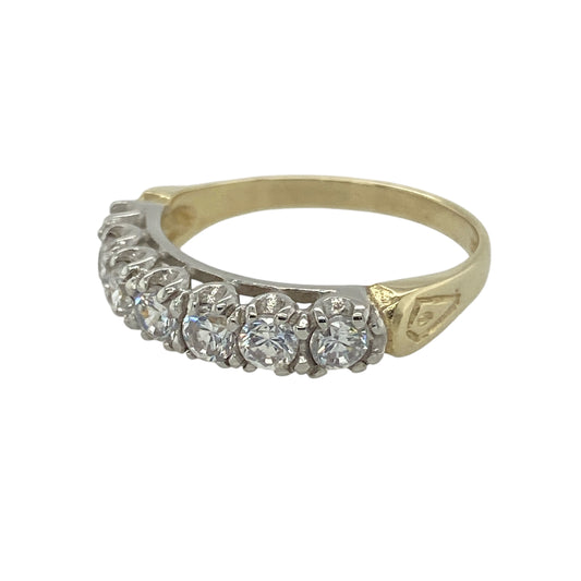Bring timeless sparkle and refined elegance to your collection with this pre-owned 9ct yellow gold cubic zirconia band ring, offering a classic blend of brilliance and versatile style—perfect for adding a touch of everyday luxury.

Design: The ring features a series of cubic zirconia stones, each measuring 3mm in diameter, set evenly across the band to create a continuous line of radiant sparkle.

