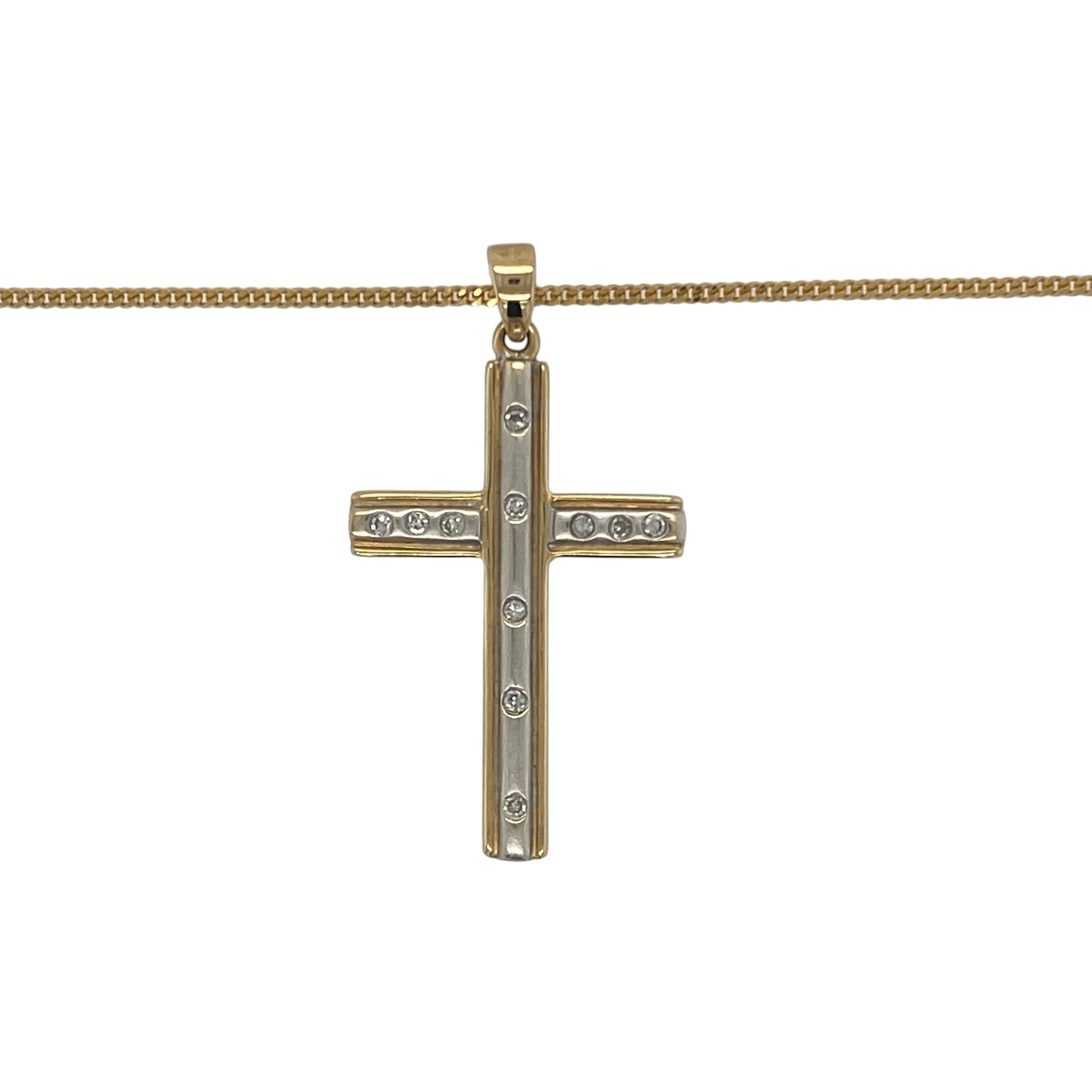 Bring meaningful elegance and radiant sparkle to your collection with this pre-owned 18ct yellow and white gold diamond set cross pendant on an 18" curb chain necklace, offering a timeless blend of faith-inspired design and luxurious detail—perfect for any occasion.

Design: The pendant features a striking cross design measuring 3.5cm long including the bail, beautifully accented with shimmering diamonds for added brilliance and depth.
