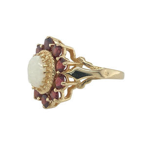 Bring vibrant colour and vintage-inspired charm to your collection with this pre-owned 9ct yellow gold garnet and opalique set cluster ring, offering a beautiful blend of elegant detail and striking contrast—perfect for making a refined statement.

Design: The ring features a captivating 7mm by 5mm oval opalique stone at the centre, surrounded by rich 3mm diameter garnet stones in a classic cluster arrangement, creating a vivid and eye-catching focal point.
