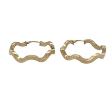 Load image into Gallery viewer, Bring elegant texture and flowing form to your collection with these pre-owned 9ct yellow gold wave style line pattern hoop creole earrings, offering a graceful design and timeless appeal — perfect for everyday wear or subtle statement styling.

Design: These stylish creole earrings feature a soft wave-inspired shape with, creating movement and visual interest in a classic hoop form.


