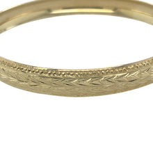 Load image into Gallery viewer, Bring graceful form and detailed elegance to your collection with this pre-owned 9ct yellow solid gold curved patterned bangle, offering timeless design and a refined finish — perfect for classic style with a bold touch.

Design: This elegant bangle features a curved profile with a generous 9mm width, beautifully enhanced by intricate patterning that adds depth and visual interest.
Material: Made from solid 9-carat yellow gold, the polished finish highlights its rich golden tone, delivering warmth
