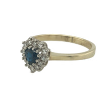 Load image into Gallery viewer, Bring romantic elegance and timeless sparkle to your collection with this pre-owned 9ct yellow gold diamond and sapphire set heart cluster ring, offering graceful detail and classic charm — perfect for celebrating love or adding a meaningful touch to your style.

Design: The ring features a central 5mm heart-shaped sapphire, surrounded by a cluster of shimmering diamonds that highlight the deep blue centre and create a romantic silhouette.

