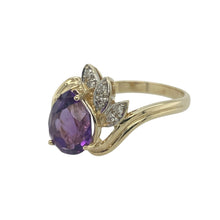 Load image into Gallery viewer, Bring rich colour and graceful sparkle to your collection with this pre-owned 9ct yellow gold diamond and amethyst set twist ring, offering an elegant silhouette and eye-catching design — perfect for statement wear or refined everyday luxury.

Design: The ring features a 9mm by 7mm teardrop-shaped amethyst as its centrepiece, accented by a fan-style arrangement of sparkling diamonds that follow the curve of the twisted setting.
Material: Made from 9-carat yellow gold
