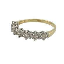 Load image into Gallery viewer, Bring timeless brilliance and luxurious elegance to your collection with this pre-owned 18ct yellow gold and diamond set seven stone band ring, offering classic sparkle and refined craftsmanship — perfect for marking special milestones or adding lasting shine to your everyday style.

Design: This elegant band features seven round-cut diamonds set evenly across the front, with a total estimated diamond weight of approximately 1.00ct, creating a continuous line of brilliance.

