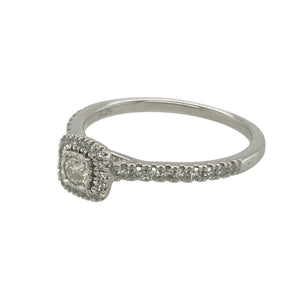 Bring radiant sparkle and refined elegance to your collection with this pre-owned 9ct white gold and diamond set halo style ring, offering timeless brilliance and graceful design — perfect for special occasions or everyday luxury.

Design: This classic halo ring features a central cluster of diamonds surrounded by a delicate diamond-set halo, with a total diamond weight of approximately 0.25ct, creating a bright and balanced look.
