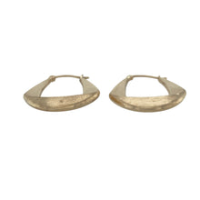 Load image into Gallery viewer, Bring soft texture and modern elegance to your collection with these pre-owned 9ct yellow gold brushed effect oval creole earrings—a stylish twist on a classic everyday design.

Design: The earrings feature a sleek oval creole shape with a subtle brushed finish, adding gentle texture and contemporary appeal.
Material: Made from 9-carat yellow gold, the matte-effect surface gives a refined and understated look while retaining a warm, golden glow.

