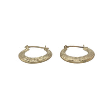 Load image into Gallery viewer, Bring delicate detail and natural elegance to your collection with these pre-owned 9ct yellow gold small leaf patterned hoop creole earrings—a light and graceful design with timeless charm.

Design: The earrings feature a classic hoop creole shape adorned with an engraved leaf pattern, offering a subtle nod to nature with refined texture.
Material: Made from 9-carat yellow gold, the polished finish enhances the fine detailing while giving a warm and gentle glow.

