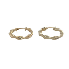 Load image into Gallery viewer, Bring graceful movement and subtle texture to your collection with these pre-owned 9ct yellow gold ribbon twist hoop creole earrings—a delicate design with timeless style and elegant detail.

Design: The earrings feature a classic hoop creole shape with a flowing ribbon twist design, adding a sense of movement and light-catching dimension.
Material: Made from 9-carat yellow gold, the polished finish enhances the curves of the twist and adds a soft, radiant shine.

