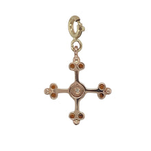 Load image into Gallery viewer, Bring rich symbolism and elegant sparkle to your collection with this pre-owned 9ct yellow and rose gold diamond and garnet set Welsh Clogau cross clip-on charm—a meaningful design with timeless beauty and heritage appeal.

Design: The charm features a delicately crafted cross accented with a deep red garnet at the centre and a single diamond for subtle sparkle, all framed by a blend of yellow and rose gold in Clogau’s signature style.

