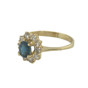 Bring classic elegance and timeless sparkle to your collection with this pre-owned 18ct yellow gold diamond and sapphire set cluster ring—a refined design that combines rich colour with vintage-inspired brilliance.

Design: The ring features a 5mm by 4mm oval sapphire at the centre, surrounded by a sparkling halo of brilliant-cut diamonds in a traditional cluster setting for a beautifully balanced look.
