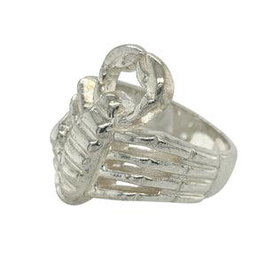 Bring fierce style and bold symbolism to your collection with this new 925 solid silver scorpion ring—a striking design with powerful detail and commanding presence.

Design: The ring features an intricately detailed scorpion spanning the 3cm high front, capturing its curved tail, pincers, and segmented body in bold, sculptural form.
Material: Made from solid 925 sterling silver, the polished and oxidised finish enhances the three-dimensional detailing and adds depth to the design.
