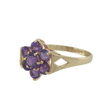 Load image into Gallery viewer, Bring graceful colour and vintage-inspired charm to your collection with this pre-owned 9ct yellow gold and amethyst flower cluster ring—an elegant choice with soft purple tones and timeless appeal.

Design: A central round-cut amethyst is surrounded by smaller amethysts arranged in a floral cluster, creating a delicate and feminine silhouette.
Material: Made from 9-carat yellow gold, the band offers a warm contrast to the cool lilac hue of the stones, highlighting the petal-like shape.

