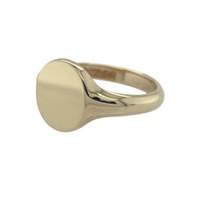 Load image into Gallery viewer, Bring classic form and polished elegance to your jewellery collection with this pre-owned 9ct yellow gold oval plain signet ring—offering timeless style with a bold, refined finish.

Design: A smooth, 11mm high oval face sits at the front, creating a clean and traditional silhouette perfect for everyday wear or personalisation.
Material: Made from 9-carat yellow gold, the polished surface enhances the warm glow of the metal for a sleek and sophisticated look.

