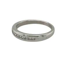 Load image into Gallery viewer, Add sleek sophistication and contemporary sparkle with this pre-owned 9ct white gold band ring, featuring elegant princess cut diamonds in a clean, modern setting.

Design: The front of the band measures 3.5mm wide and is channel set with square princess cut diamonds, creating a smooth and structured line of brilliance.
Material: Made from 9-carat white gold, the cool-toned finish offers a polished backdrop that enhances the clarity and geometric beauty of the diamonds.


