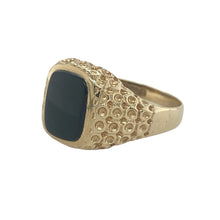 Load image into Gallery viewer, Add bold contrast and classic style to your collection with this pre-owned 9ct yellow gold signet ring, featuring a sleek onyx stone and understated detailing.

Design: The ring features a 9mm by 7mm rectangular onyx stone set into a traditional signet face, with patterned shoulders that add subtle texture and definition.
Material: Made from 9-carat yellow gold, the polished finish offers a warm contrast to the smooth, deep black of the onyx.

