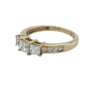 Add classic sparkle and symbolic style to your collection with this pre-owned 9ct yellow gold cubic zirconia trilogy ring—elegant, timeless, and full of brilliance.

Design: The ring features a central trio of cubic zirconia stones symbolising past, present, and future, with additional smaller stones set along the shoulders for extra sparkle.
Material: Made from 9-carat yellow gold, the polished finish provides a warm glow that enhances the clarity and brilliance of the stones.
