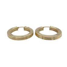 Load image into Gallery viewer, Add bold texture and modern edge to your look with these pre-owned 9ct yellow gold line style square tube hoop creole earrings—stylish, structured, and full of shine.

Design: These creole earrings feature a square tube profile with a textured line-style finish, combining sharp angles and eye-catching detail for a contemporary twist on a classic hoop.
Material: Made from 9-carat yellow gold, the polished and textured surfaces reflect light beautifully while adding depth and dimension.

