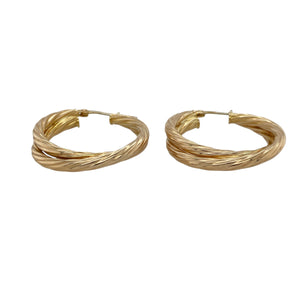 Make a bold statement with these pre-owned 9ct yellow gold double hoop twist creole earrings—stylish, eye-catching, and full of movement.

Design: These earrings feature an elegant double hoop design with a twisted creole shape, creating layered curves that catch the light from every angle.
Material: Made from 9-carat yellow gold, the high-polish finish enhances the sculptural form and adds a luxurious golden glow.
