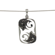 Load image into Gallery viewer, Add modern edge and refined detail to your look with this pre-owned 9ct white gold black diamond tag pendant necklace—stylish, distinctive, and full of character.

Design: The 2.9cm long pendant features an open cut-out pattern on a sleek tag shape, accented with a black diamond for a subtle touch of contrast and sparkle.
Material: Made from 9-carat white gold, the polished finish highlights the contemporary design and complements the depth of the black diamond.

