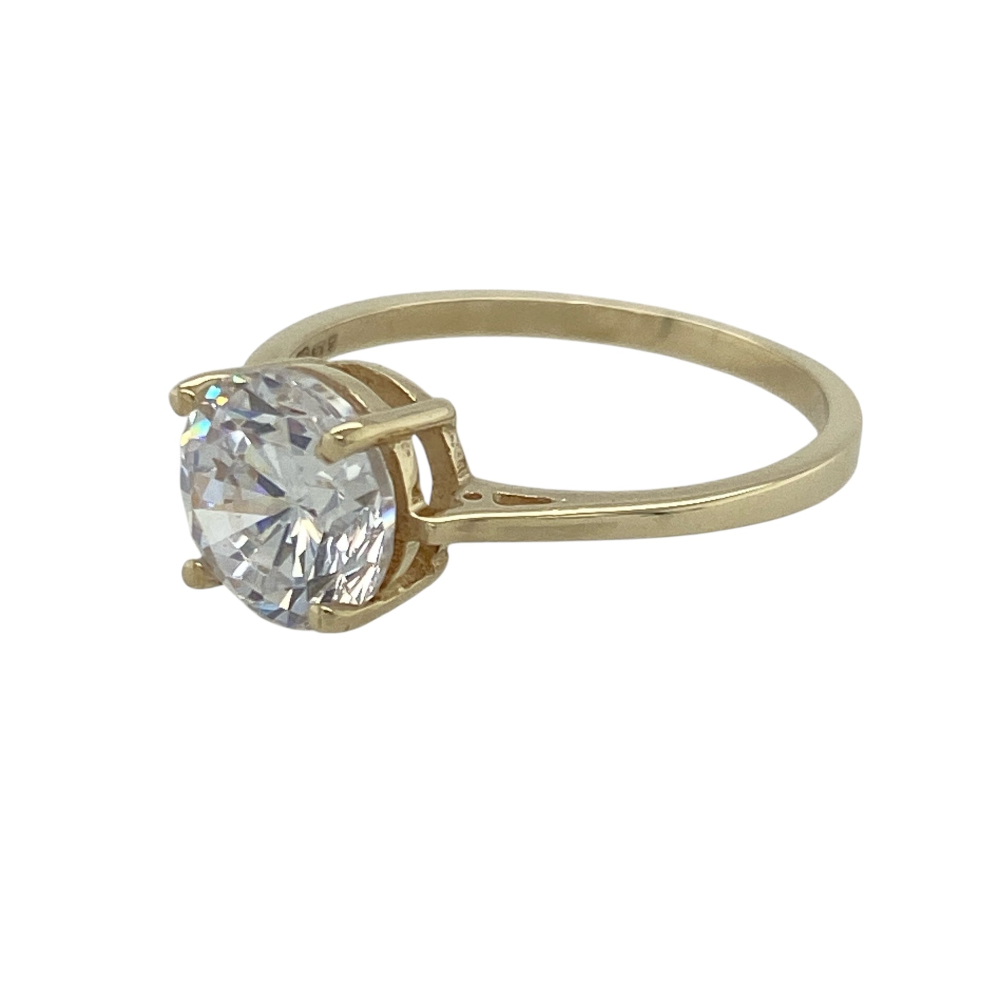 Bright and eye-catching, this pre-owned 9ct yellow gold solitaire ring offers classic elegance with a bold centrepiece—perfect for adding sparkle to everyday wear or marking a special moment.

Design: The ring features a single round cubic zirconia measuring 8mm in diameter, held in a traditional solitaire setting for maximum brilliance and timeless appeal.
Material: Made from 9-carat yellow gold, the polished band provides a warm, classic contrast to the clear sparkle of the stone.
