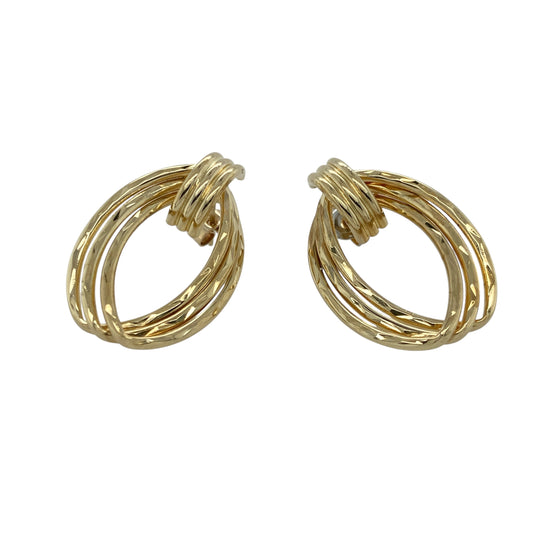 Elegant with a touch of vintage flair, these pre-owned 9ct yellow gold drop earrings offer graceful movement and intricate detail—perfect for dressing up any occasion.

Design: Each earring features an elongated oval drop with ornate fancy detailing, creating a delicate and eye-catching silhouette.
Material: Made from 9-carat yellow gold, the polished finish enhances the intricate design with a warm, radiant glow.
