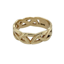 Load image into Gallery viewer, Intricate and meaningful, this pre-owned 9ct yellow gold Celtic band ring features a timeless open weave design—perfect for celebrating heritage, connection, and enduring style.

Design: The ring showcases a 5mm wide band with an open Celtic weave pattern, symbolising eternity and interconnectedness through its continuous looping design.
Material: Made from 9-carat yellow gold, the polished finish enhances the flowing lines and detailed craftsmanship of the woven pattern.

