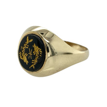 Load image into Gallery viewer, Striking and symbolic, this pre-owned 9ct yellow gold onyx signet ring features bold contrast and meaningful design—perfect for those who appreciate unique detail with timeless appeal.

Design: The ring showcases a 12mm by 10mm oval onyx stone set with two gold-etched fish in a yin-yang style, symbolising balance, harmony, and duality.
Material: Made from 9-carat yellow gold, the polished finish enhances the rich contrast between the deep black onyx and the detailed gold inlay.


